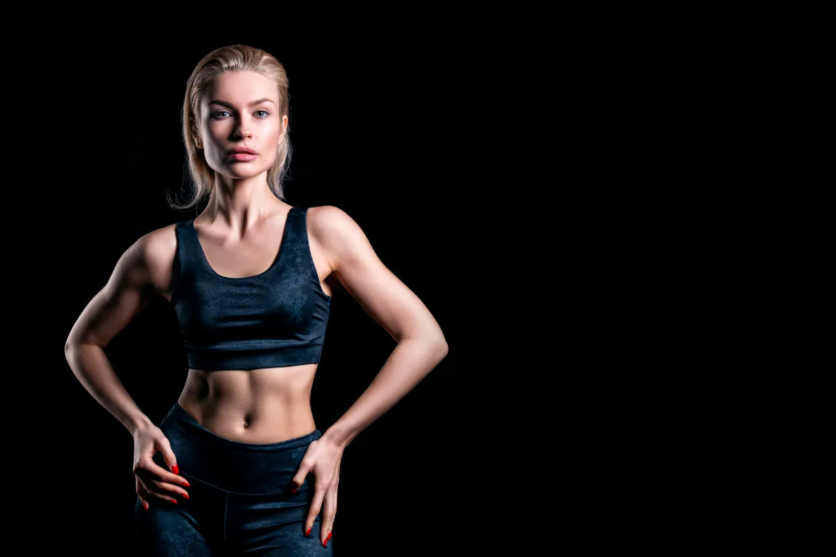 slim and fit woman looking at the camera enjoying the benefits of a fat burning supplement