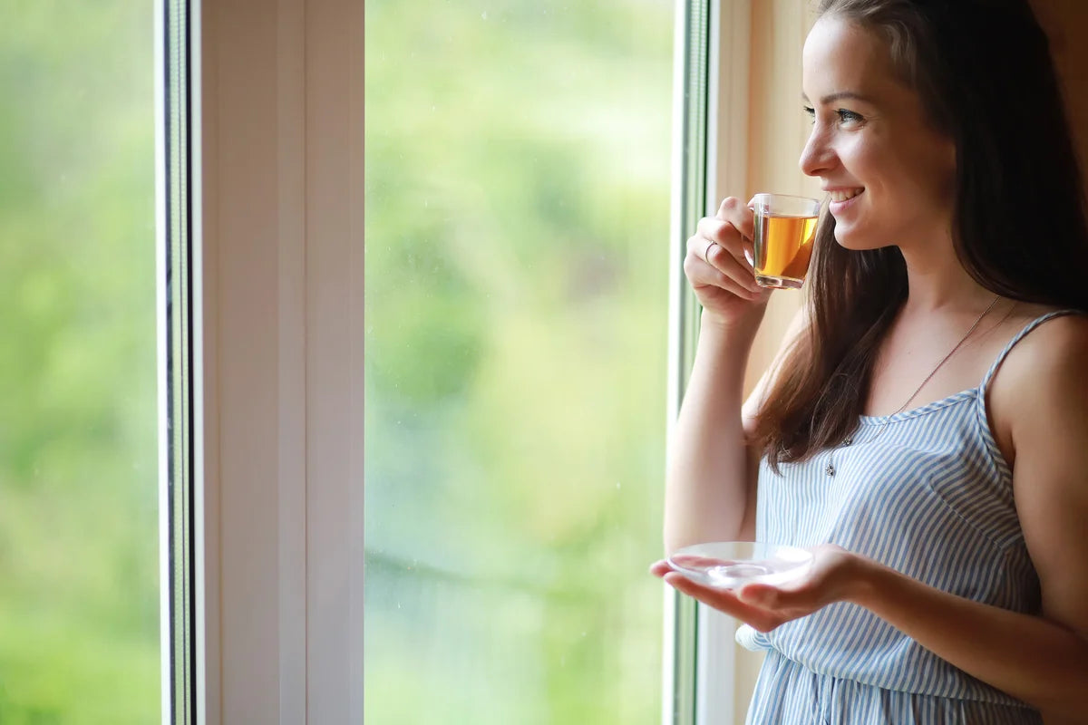 woman drinking green tea as metabolism booster